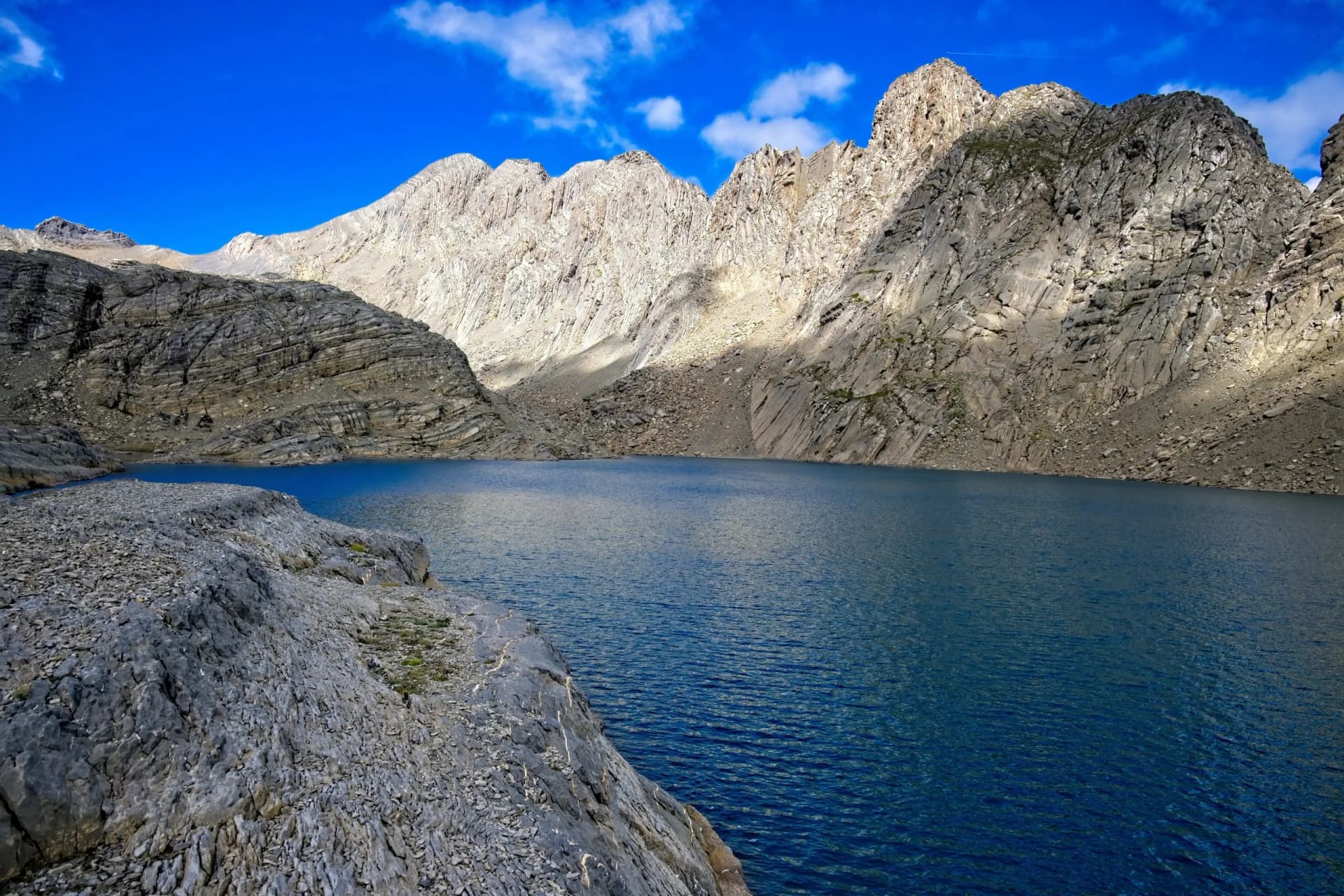 The blue waters of Marbore lake in the hanging valley above the Pineta Gorge