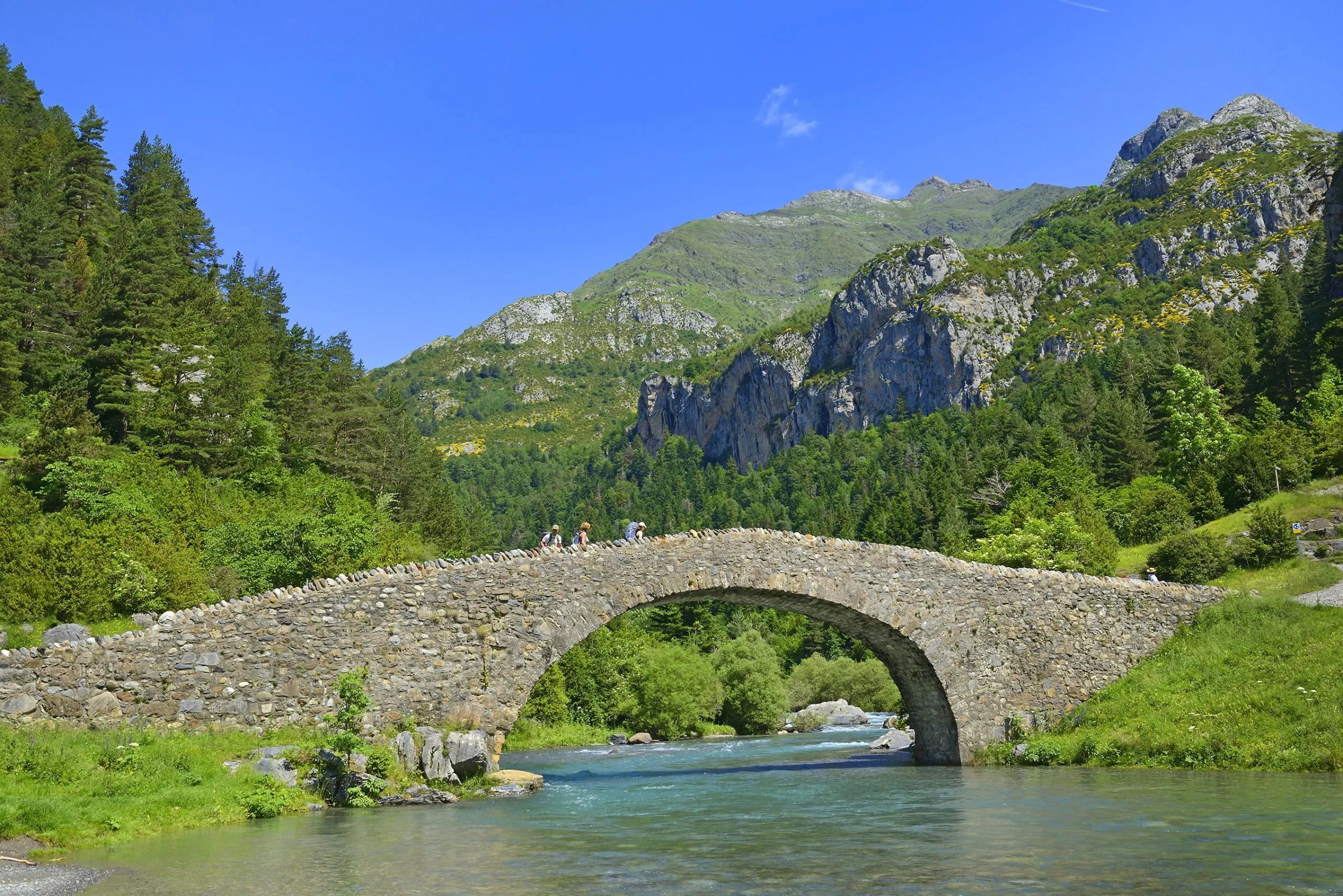 Romanesque bridge in the valley of Bujaruelo, XIII century on the Ara river, in the Aragonese Pyrenees, Huesca, Spain